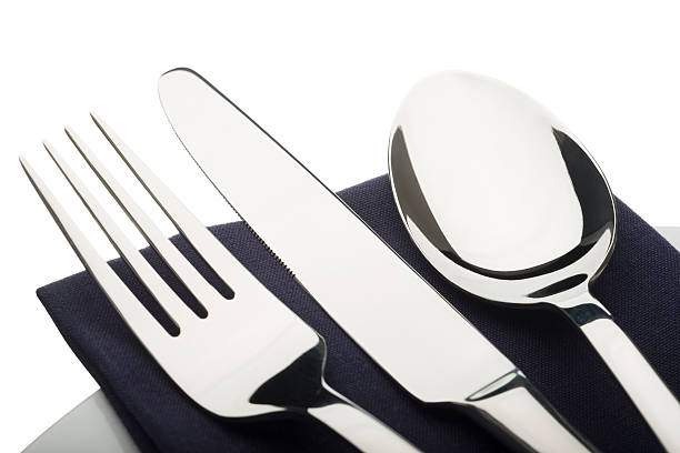 istock Knife fork and spoon on a blue napkin 450297243