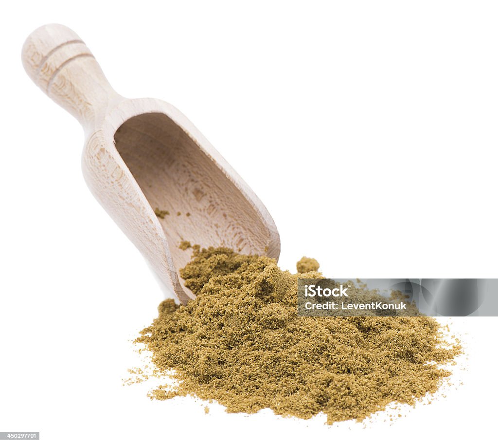 Shovel of Cumin Wooden scoop with cumin powder isolated on white background Cumin Stock Photo
