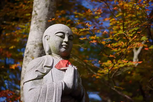 Jizo Bodhisattva and fall foliage in Daisenji Temple.