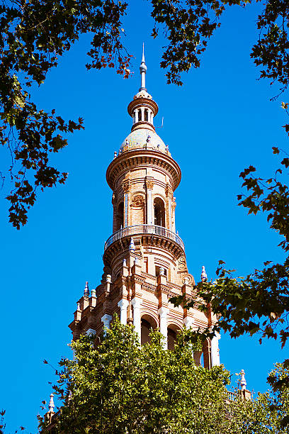 башня колокола в plaza de españa.  севилья, испания - malaga seville cadiz andalusia стоковые фото и изображения