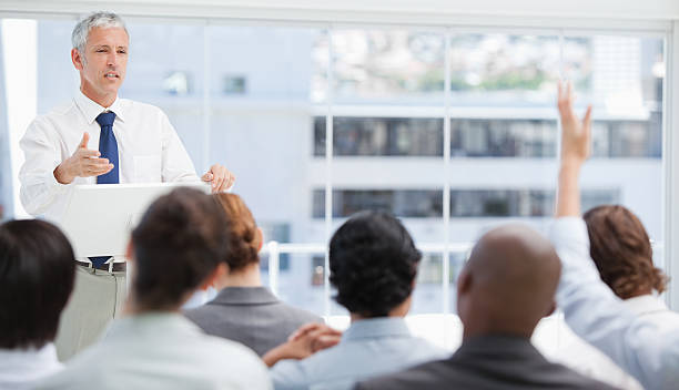 istock Businesswoman raising her hand while a colleague is gesturing 450300959