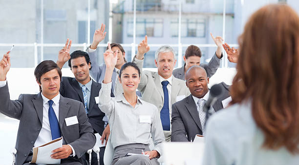 istock Business team raising their arms while looking at a woman 450301127