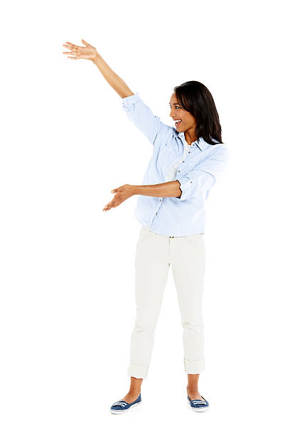 istock Attractive young woman showing space for your advertisement 450303667