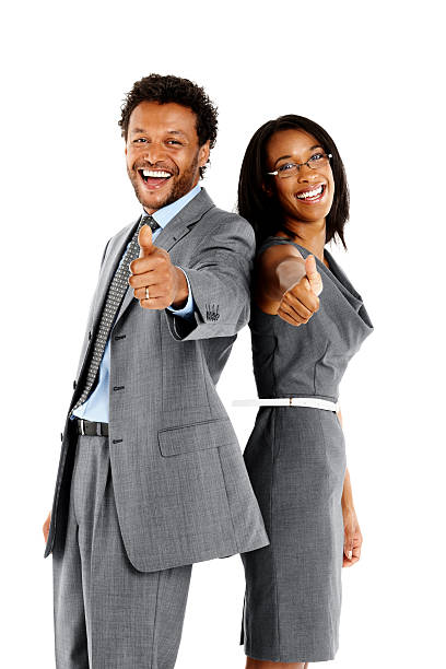 istock Happy business executives gesturing thumbs sign 450303847