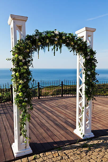 istock wedding arch over the sea 450303901