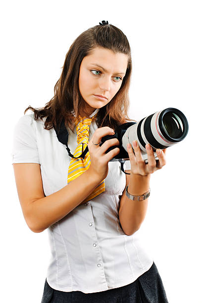 Young woman holding SLR camera