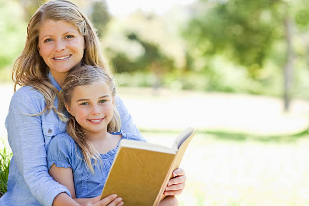 istock Mother and daughter enjoying a book 450304941