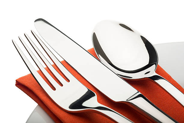 istock Silver cutlery set on an Orange napkin 450305007