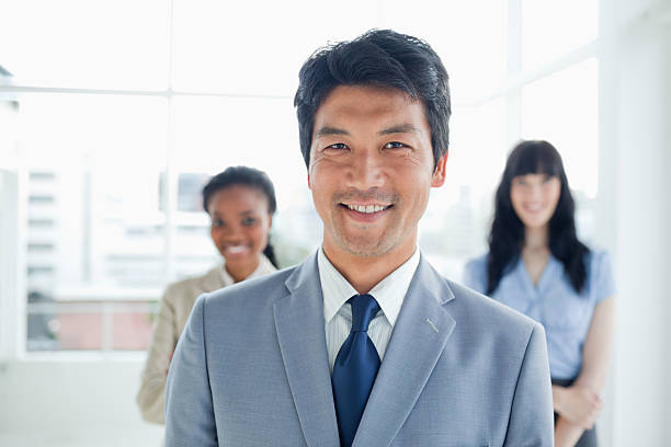 istock Smiling businessman with two colleagues 450308673