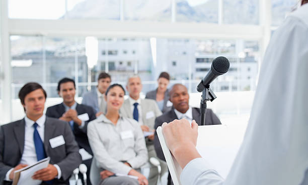 istock Woman with her hand on stand while being in meeting 450308701