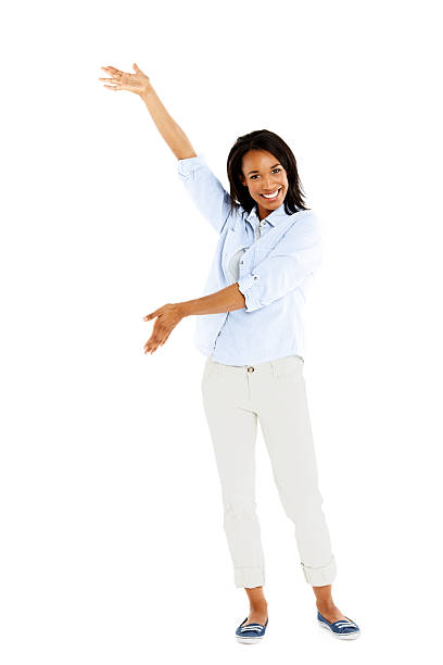 istock Beautiful african woman showing space for advertisement 450309097