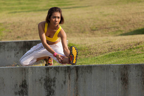 istock Asian young woman active workout at outdoor park 450309893