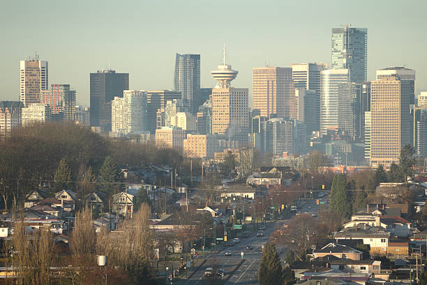 Early morning scene of the downtown Vancouver skyline behind a residential neighborhood. British Columbia, Canada.