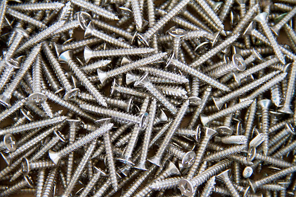 istock Many of silver screws 450323679