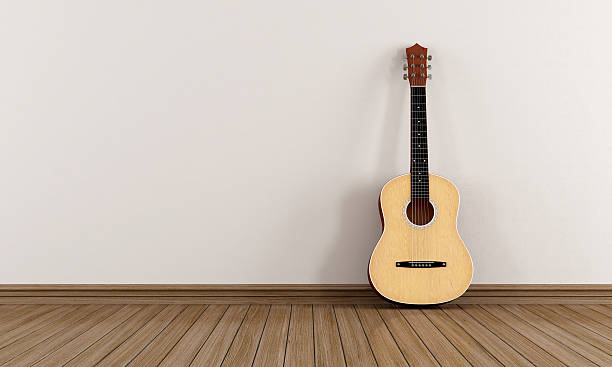 istock Acoustic guitar in a empty room 450331989