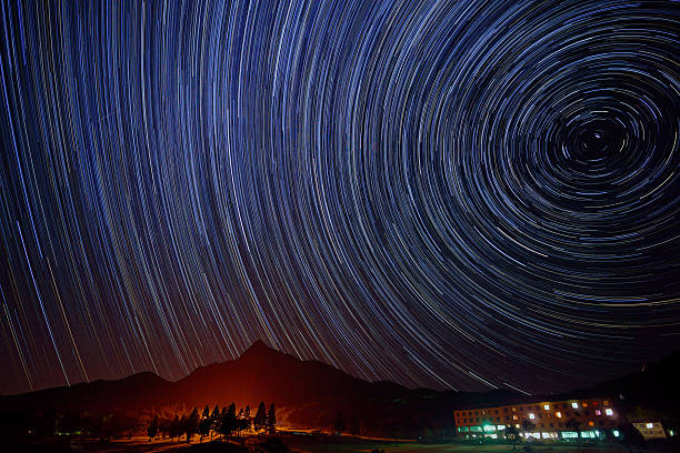 istock Star trails over the summer resort 450332089