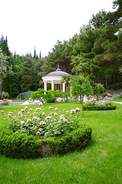 istock White stone gazebo in the park 450355739