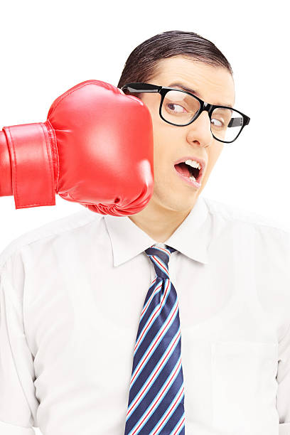 istock Young man punched by a red boxing glove 450360863
