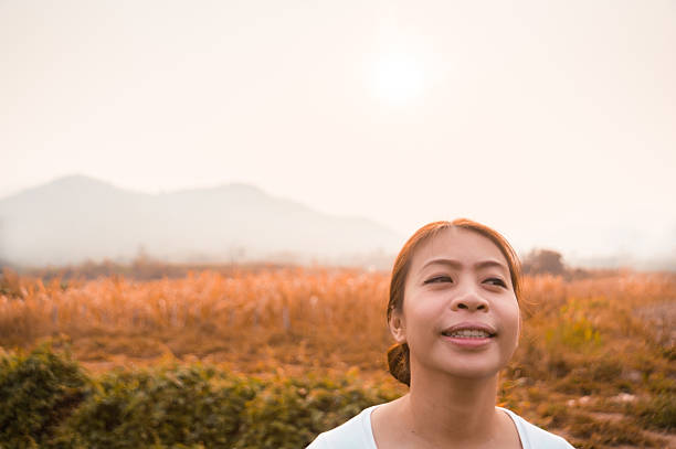 istock woman in field with sunlight 450360965