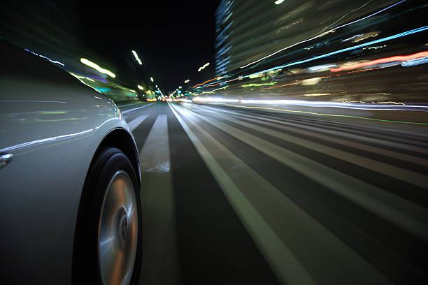 istock Driving in the night city 450365115