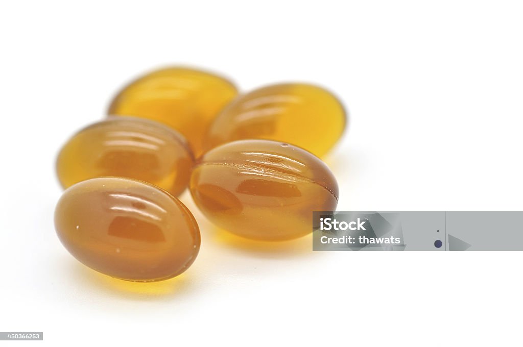 Olio di fegato di merluzzo di Omega 3 capsule - Foto stock royalty-free di Capsula