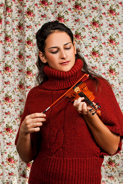 istock Woman in red over floral background 450366985