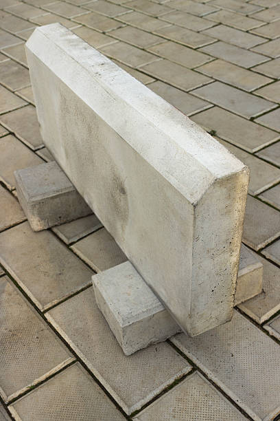 istock Large curb stone is made of concrete 450368731
