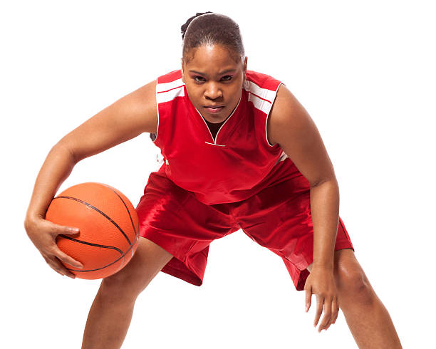 Female basketball player in red isolated on white