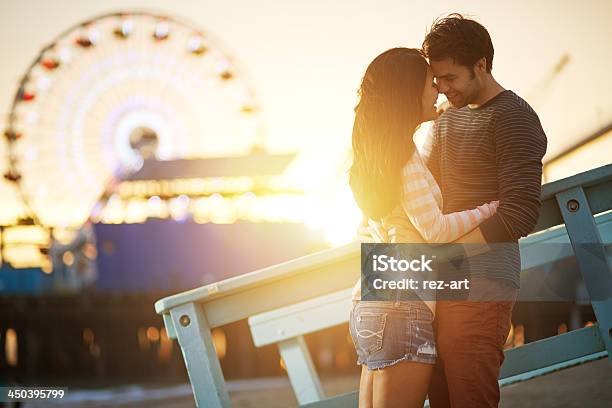 Romantic Couple Embracing At Sunset Stock Photo - Download Image Now - Couple - Relationship, Falling in Love, Dating