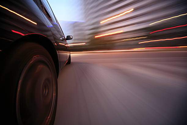 istock Driving in the sunset city 450419271