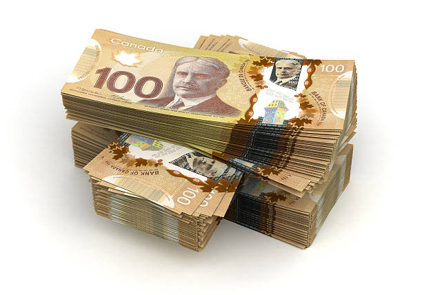 Large stack of Canadian one hundred dollar notes Stack of Canadian Dollar (isolated with clipping path) canadian currency photos stock pictures, royalty-free photos & images