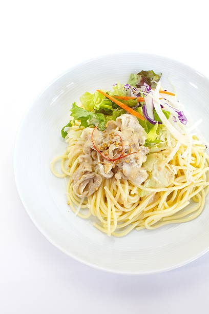 istock spaghetti pasta with green salad 450422197