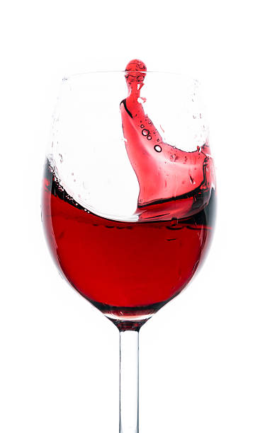 istock Glass of red wine splash 450422509