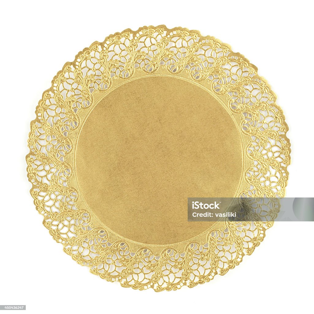 Round golden doily on white background Round golden doily isolated on white background. Lace - Textile Stock Photo