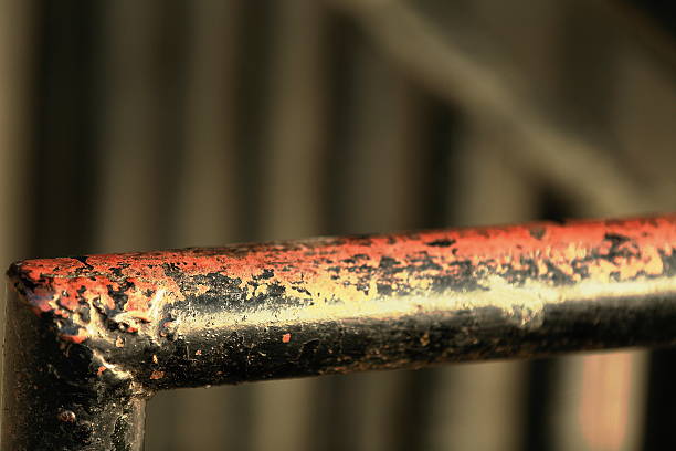 Detail of a black painted faded iron handrail on some flight of a staircase leading up t the central street of Bandipur Town-Tanahu District-Gandaki Zone-Nepal.
