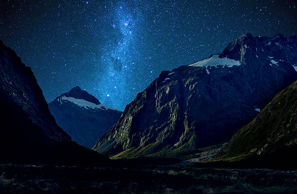 Nice star over mountain at milford sound, New Zealand Nice star over mountain at milford sound, New Zealand milford sound stock pictures, royalty-free photos & images