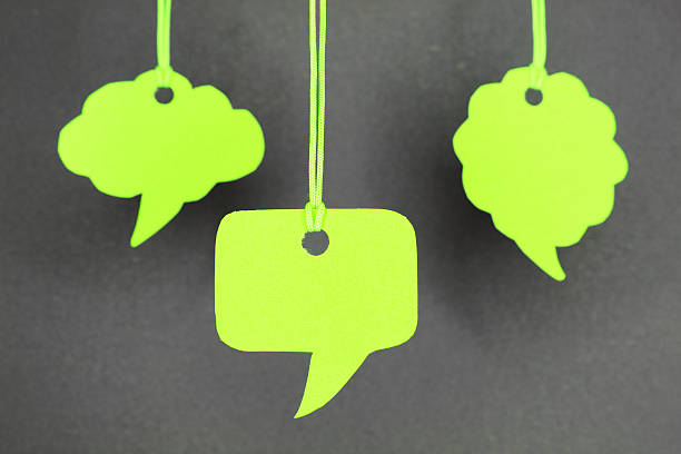 istock Speech bubbles hanging in green color 450438861