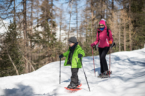 istock Mother and Son Snowshoeing 450438993