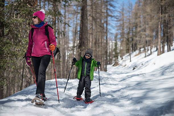 istock Mother and Son Snowshoeing 450439011