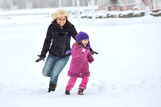 istock Happy family enjoying in winter 450439059