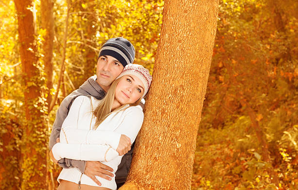 istock Happy lovers in autumn park 450441719