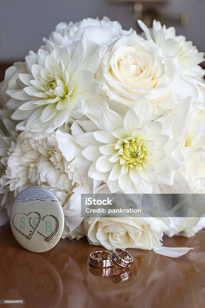 wedding rings wedding rings front of bouquet Bouquet Stock Photo