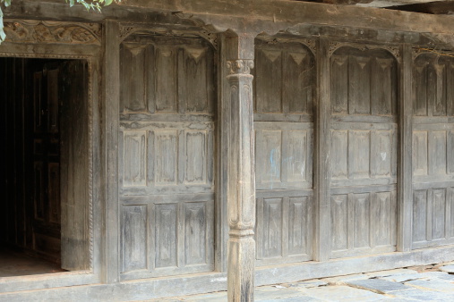 Commercial porch in carved wood-five doors sticking out to it-facing the central street of Bandipur-Tanahu District-Gandaki Zone-Nepal.