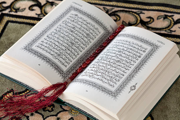istock Koran and the prayer beads 450446481