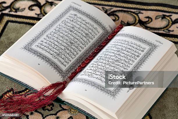 Koran And The Prayer Beads Stock Photo - Download Image Now - Arabic Script, Carpet - Decor, Holy Book