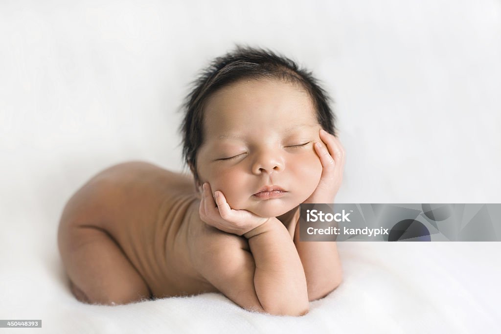 Newborn baby Newborn baby posing with hands under the chin sleeping on white blanket Baby - Human Age Stock Photo