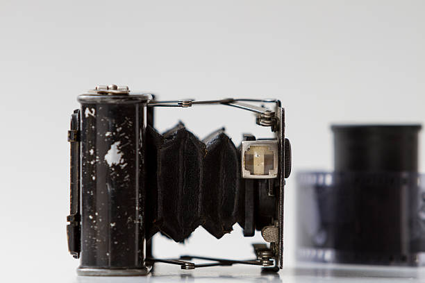 istock Isolated old vintage analog black camera detail close up. 450450293