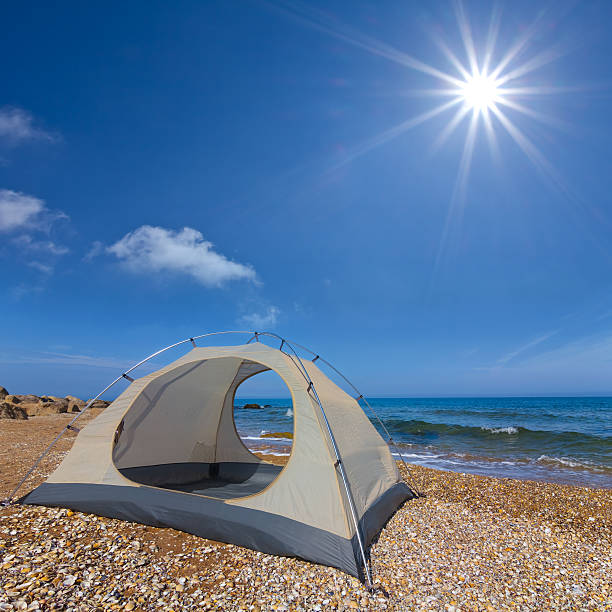 istock white touristic tent near a sea 450452279