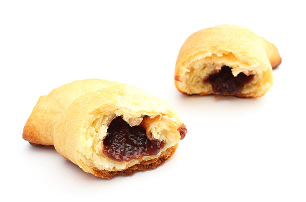 istock Fresh and sweet croissant with plum jam on white background 450453395