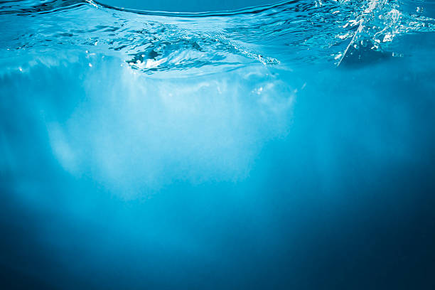 istock Abstract blue water background with sunbeams 450453461